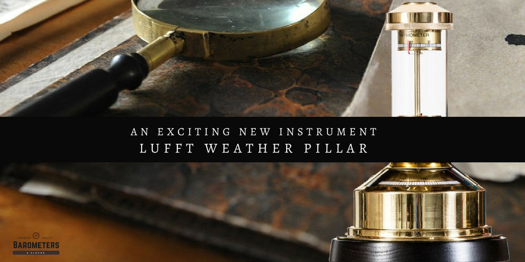 Lufft weather pillar barometer with brass base on vintage desk with magnifying glass