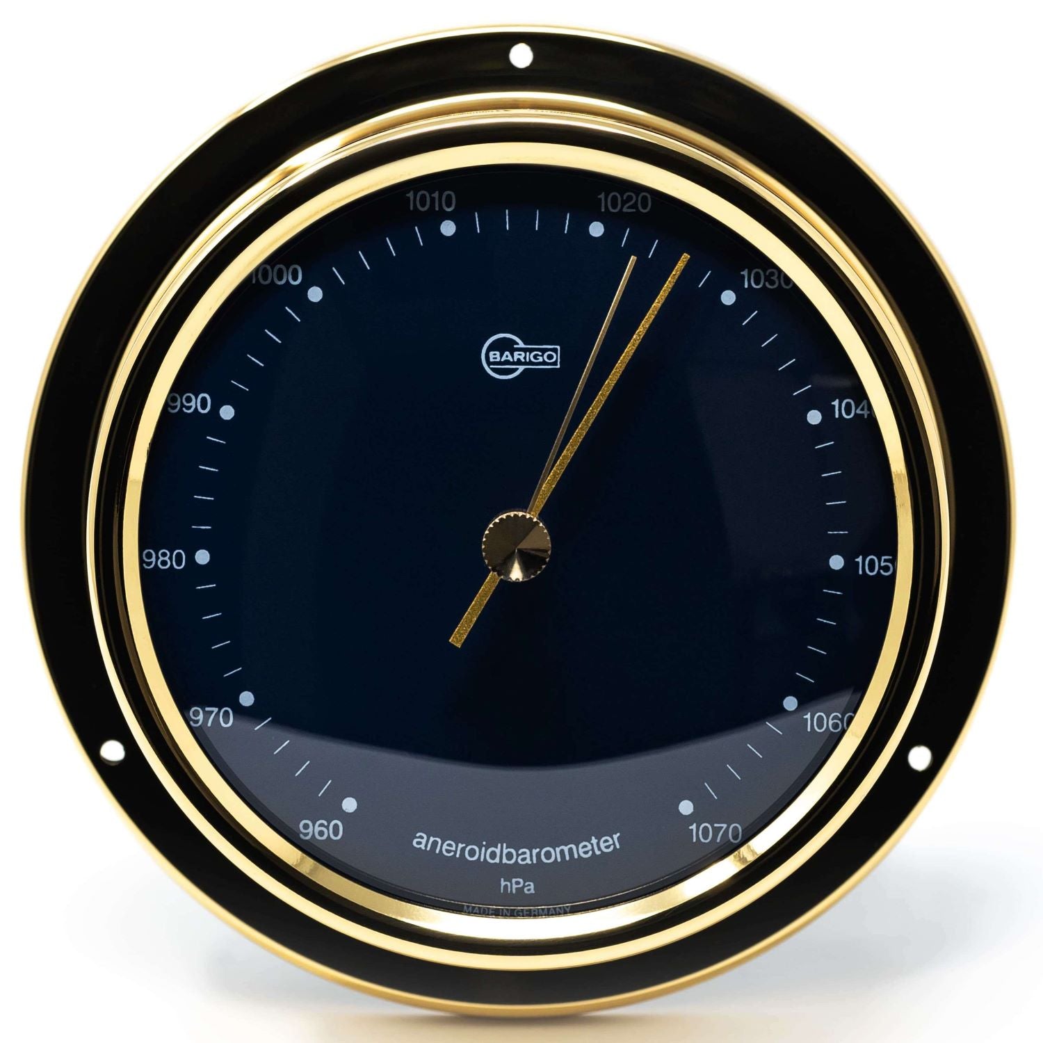 Gold-rimmed German aneroid barometer with black dial, pressure scale in hPa