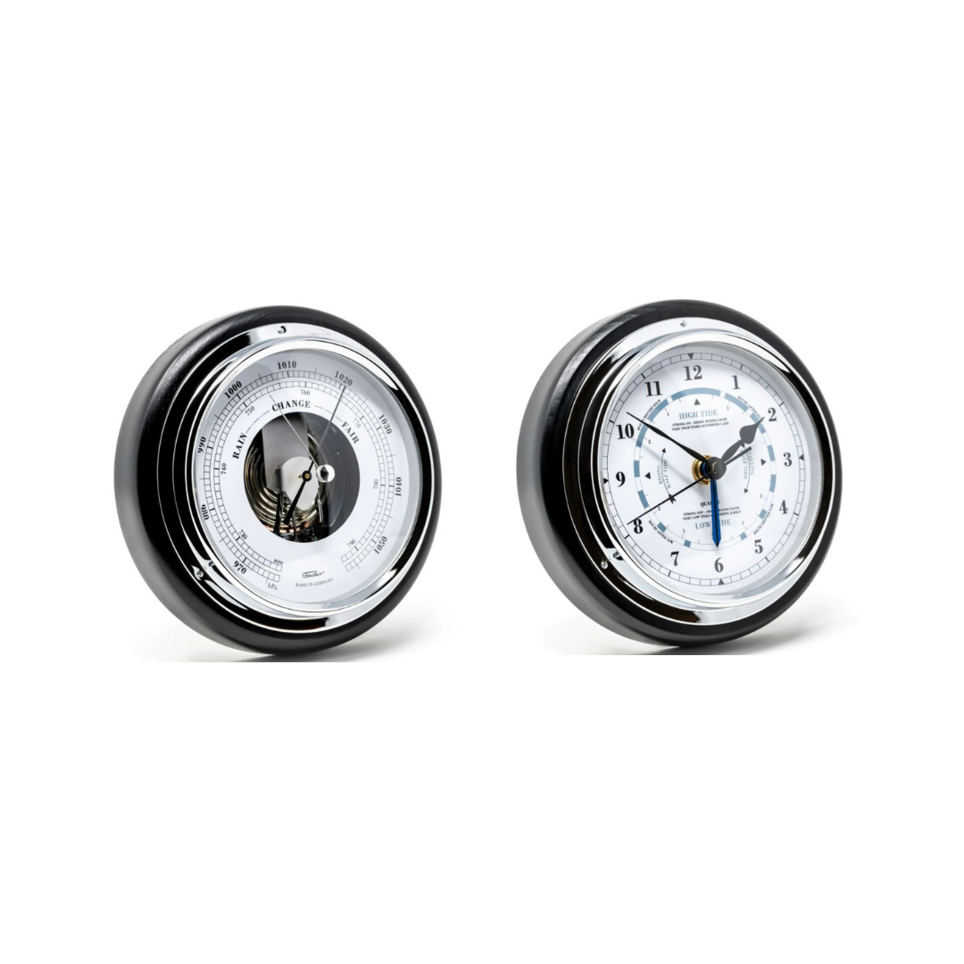 Two round chrome clock with barometers on a white background